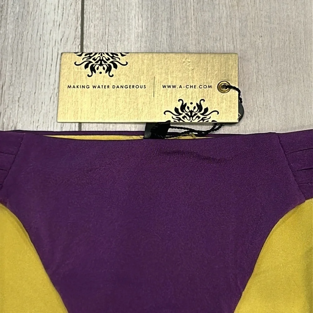 A. Che reversible swim bikini bottom Purple yellow size small